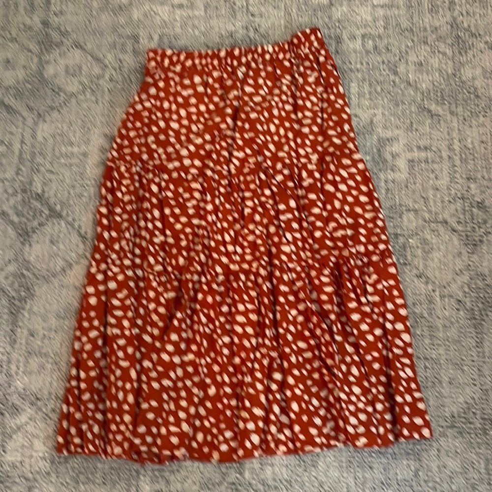 Nwot. Elastic waist skirt. Orange and white print. Never worn